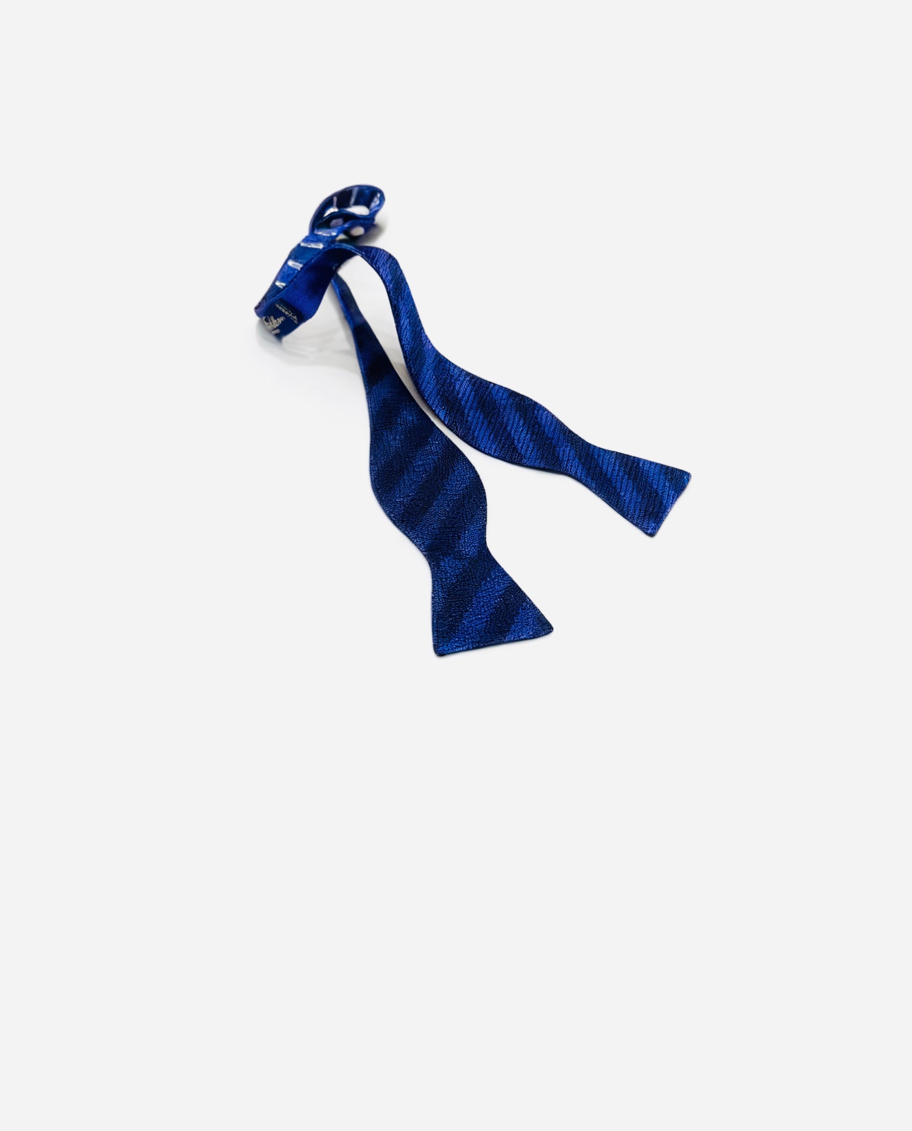 Blue striped bow tie on a white background