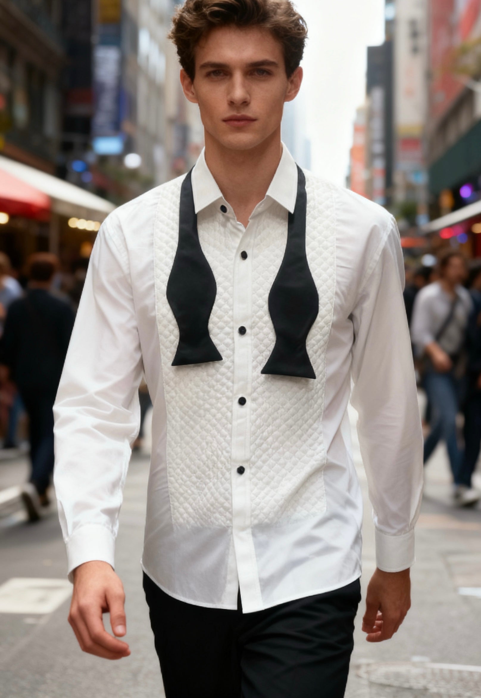 Man wearing a white shirt with black bow ties