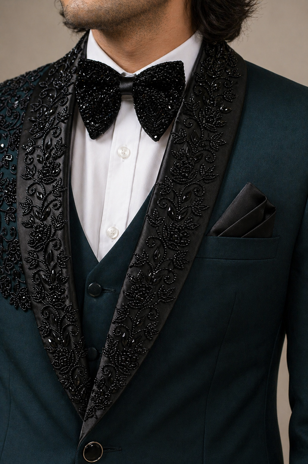 Man wearing a dark green suit with black lapels 