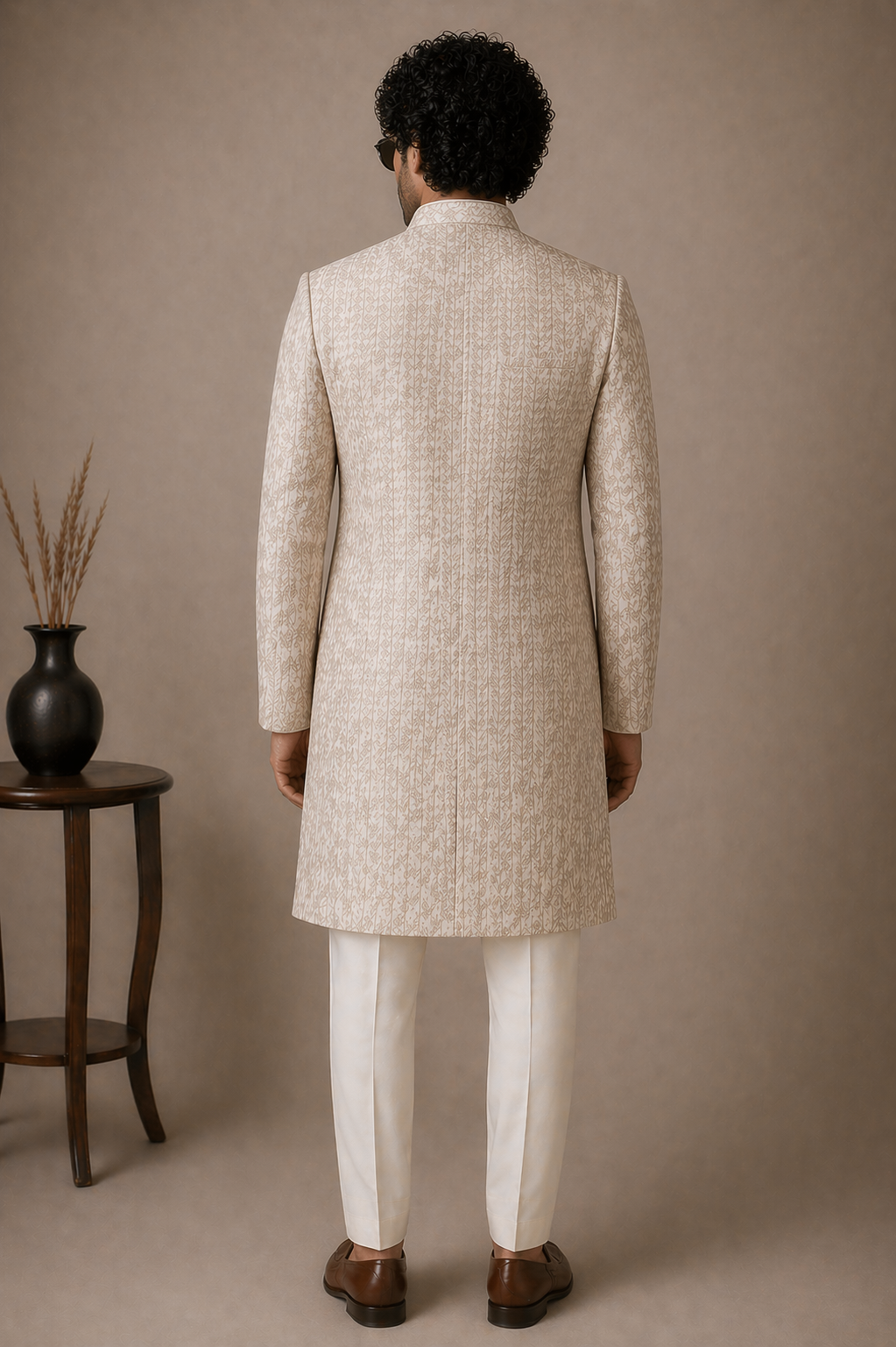 Man wearing a beige traditional sHERWANI