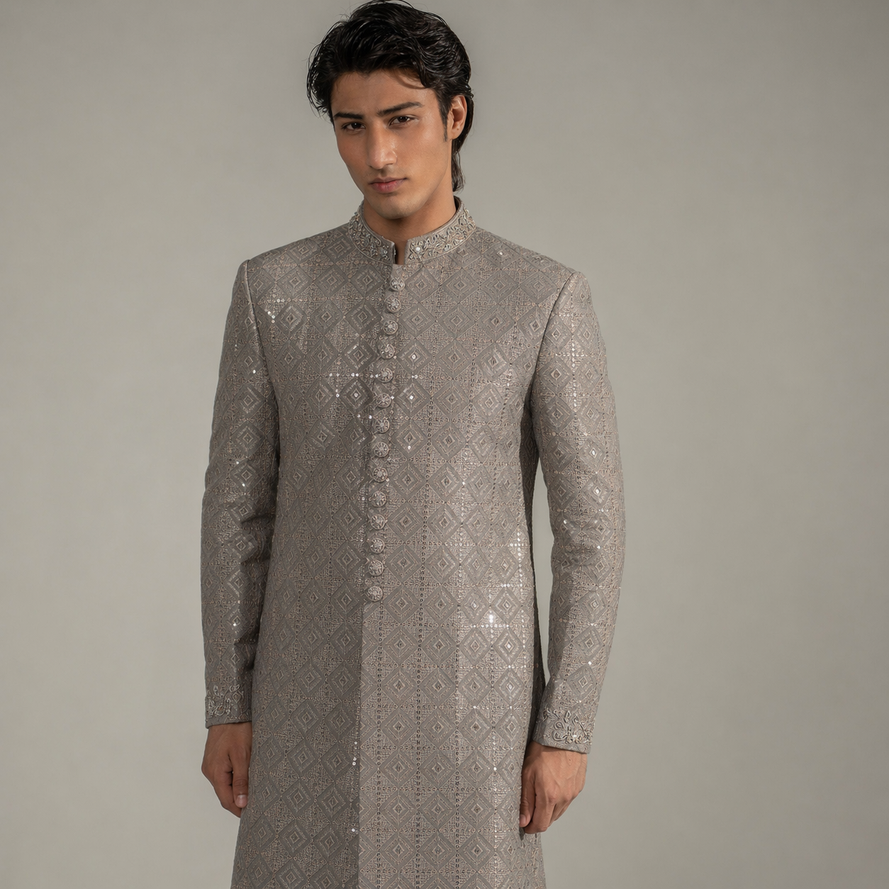 Man wearing a gray embroidered sherwani